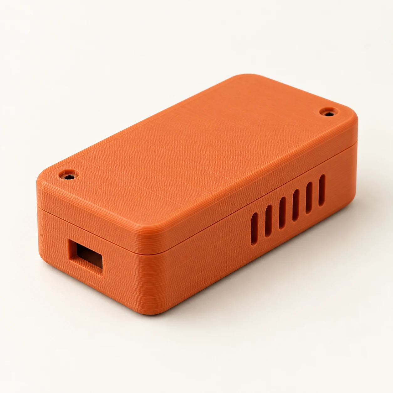 AI-assisted concept of an orange 3D printed enclosure with vents and a fitted lid
