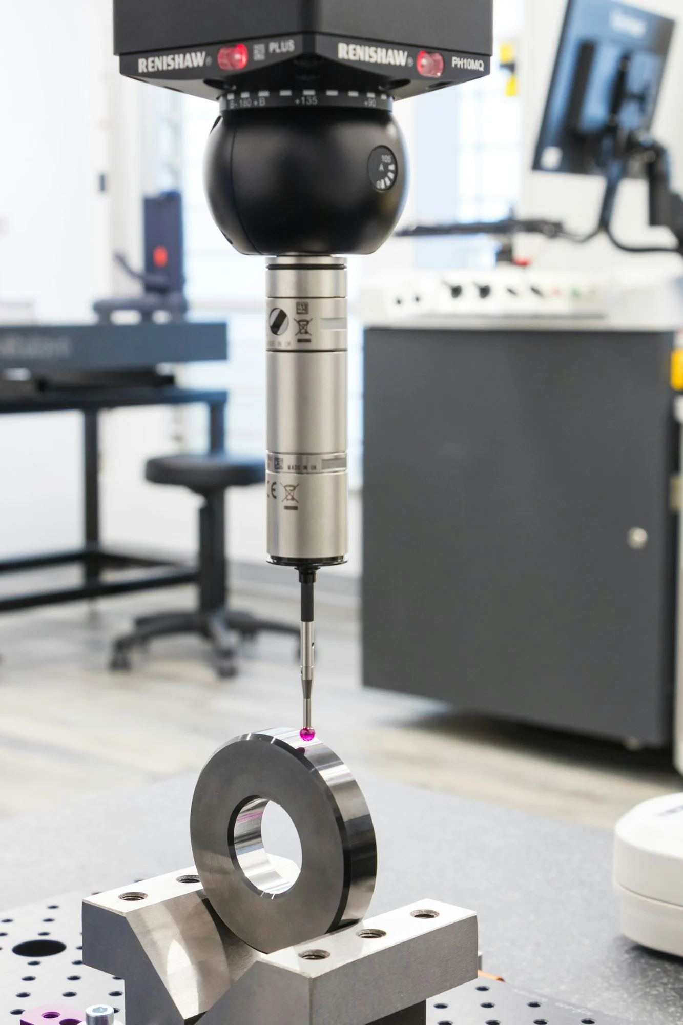 Coordinate measurement probe in a bright metrology workspace
