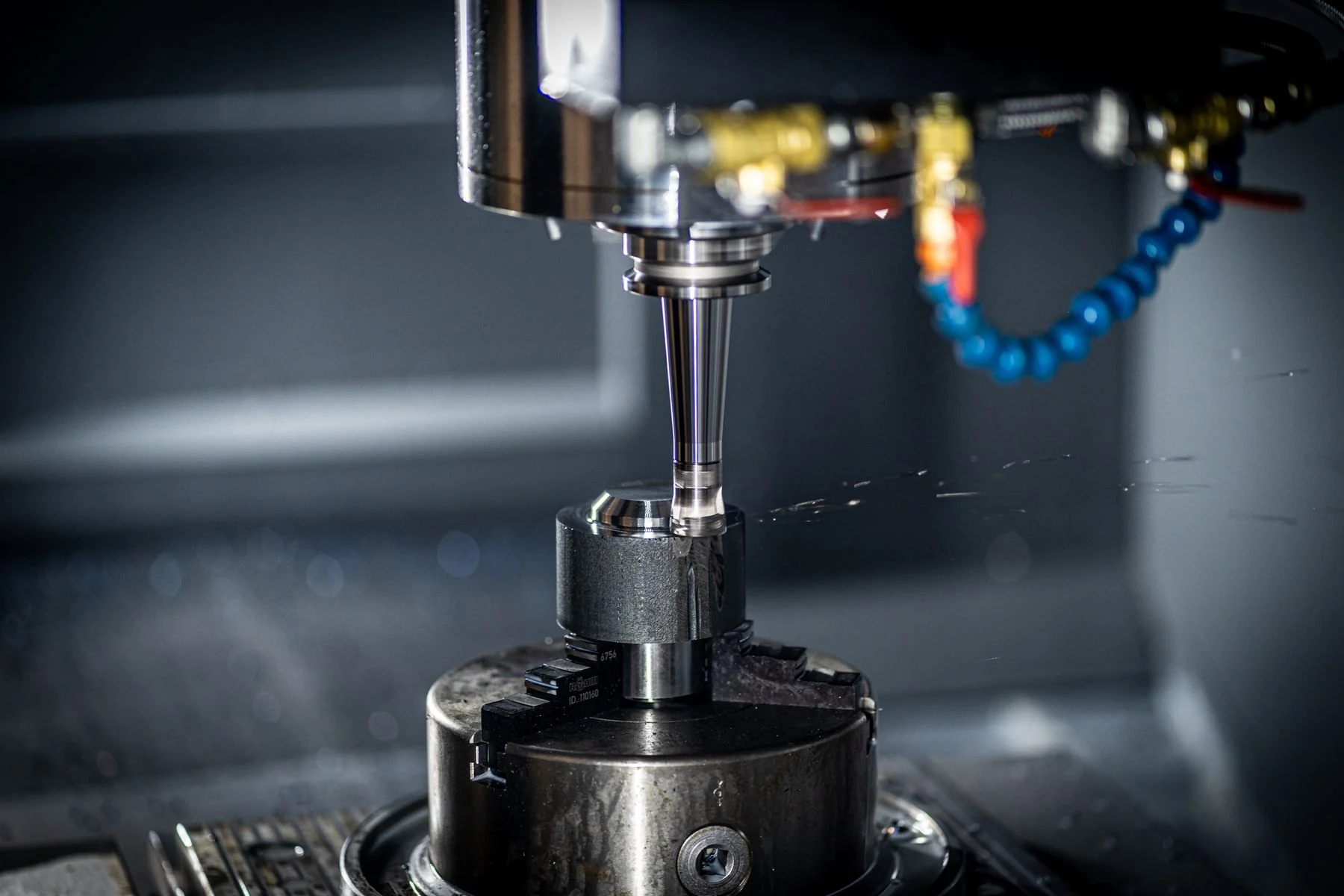 CNC spindle and cutting tool working on a metal component